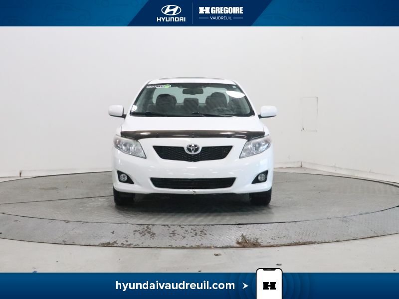 2009 Toyota Corolla White Laval - photo #2